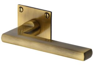 Heritage Brass Trident Low Profile Antique Brass Door Handles On Square Rose (Sold In Pairs)