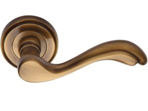 Heritage Brass Lisboa Antique Brass Door Handles On Round Rose