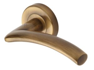 Heritage Brass Centaur Antique Brass Door Handles On Round Rose