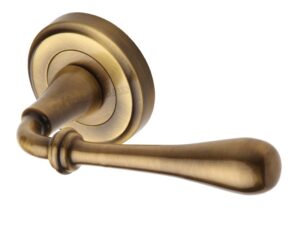 Heritage Brass Roma Antique Brass Door Handles On Round Rose