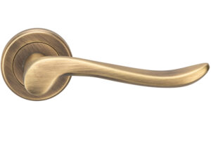 Serozzetta Verdun Door Handles On Round Rose, Antique Brass - (Sold In Pairs)