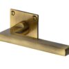 Heritage Brass Trident Low Profile Antique Brass Door Handles On Square Rose (Sold In Pairs)