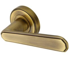 Heritage Brass Century Art Deco Style Door Handles On Round Rose, Antique Brass (Sold In Pairs)