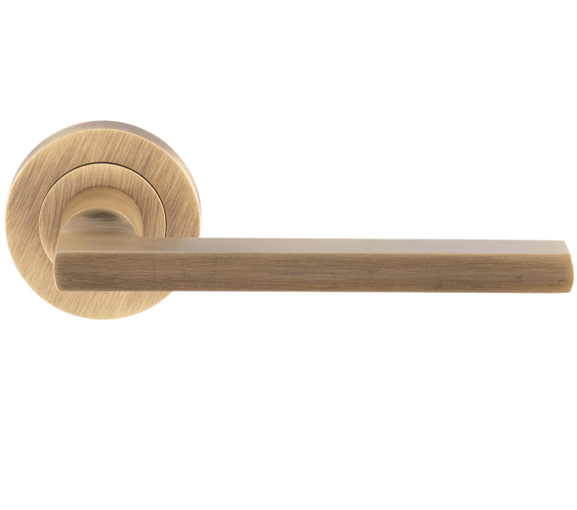 Trentino Door Handles On Round Rose, Antique Brass (Sold In Pairs)