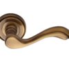 Heritage Brass Lisboa Antique Brass Door Handles On Round Rose