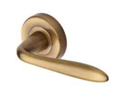 Heritage Brass Sutton Antique Brass Door Handles On Round Rose (Sold In Pairs)