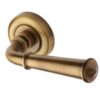 Heritage Brass Colonial Antique Brass Door Handles On Round Rose (Sold In Pairs)