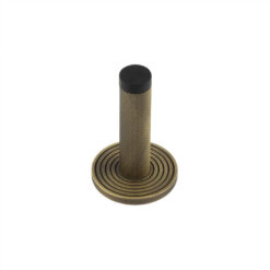 Burlington Knurled Wall Mounted Doorstops Reeded Rose Antique Brass