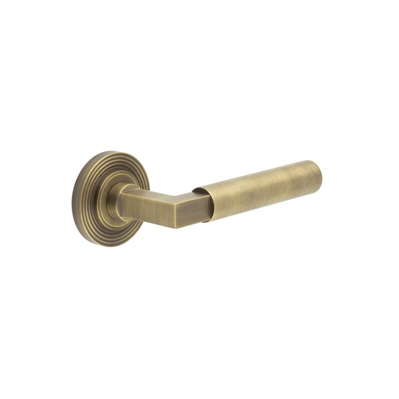 Westminster Door Handle on Reeded Rose Antique Brass